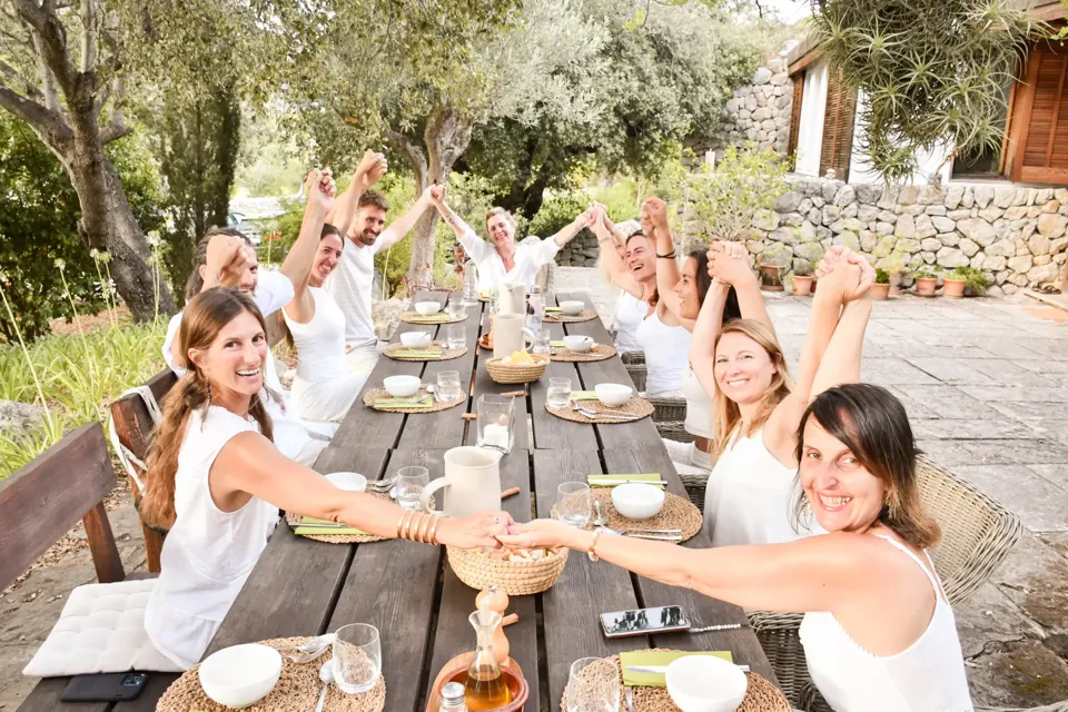 Retreat participants sharing an evening meal together on the terrace at La Serrania, Mallorca